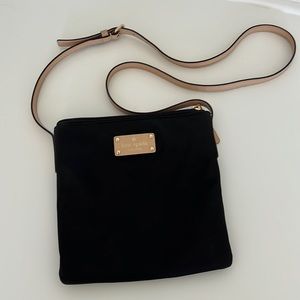 Kate Spade super cute Cross Body bag. Nylon black material wipes clean easily.